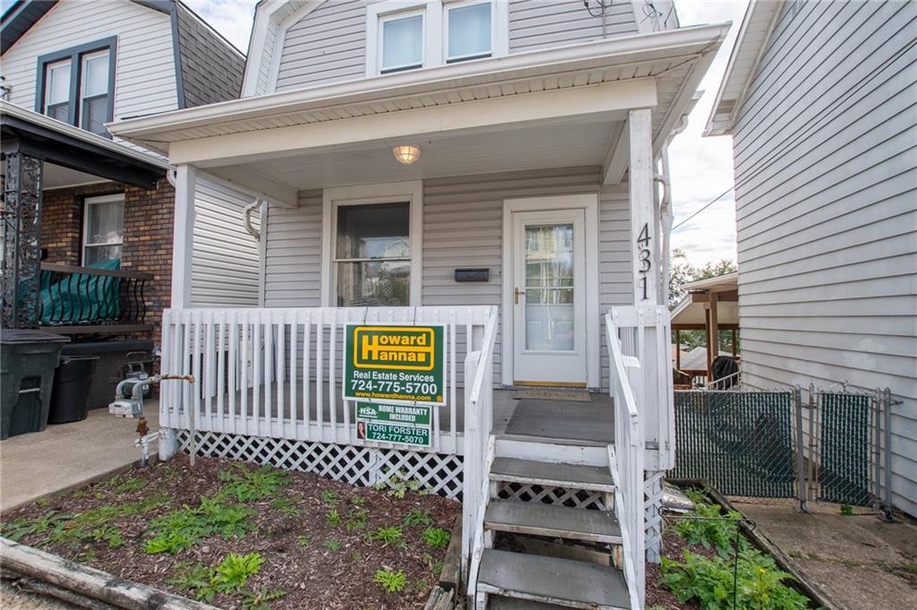 a front view of a house with a fence