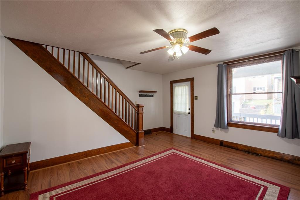 431 East Washington Street Rochester, PA 15074 - Photo 12 of 32 a view of an empty room with wooden floor and a window