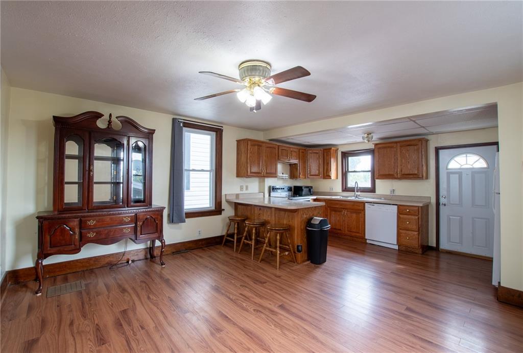 431 East Washington Street Rochester, PA 15074 - Photo 13 of 32 a view of a dining room with furniture window and wooden floor