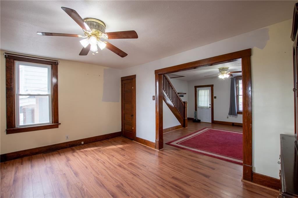 431 East Washington Street Rochester, PA 15074 - Photo 14 of 32 a view of an empty room with wooden floor and a window