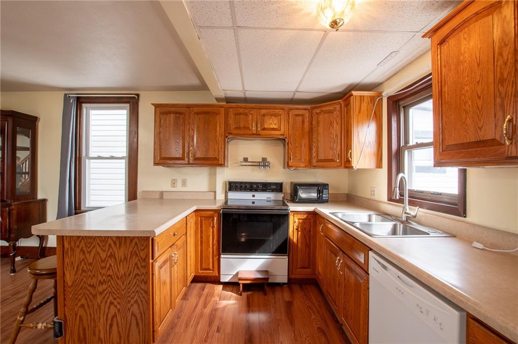 431 East Washington Street Rochester, PA 15074 - Photo 16 of 32 a kitchen with stainless steel appliances granite countertop a sink stove and cabinets