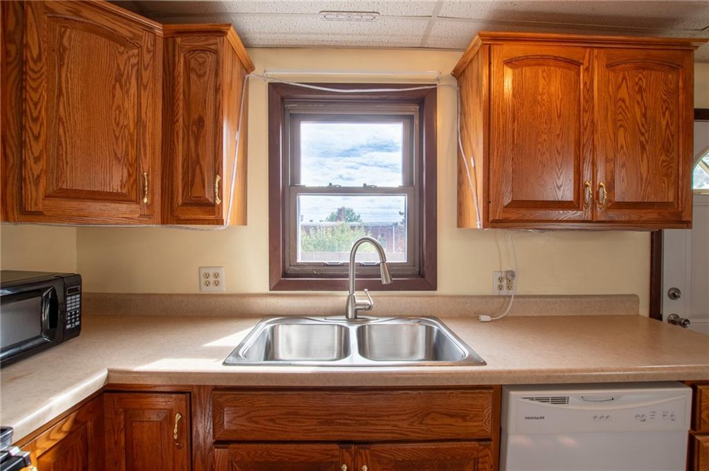 431 East Washington Street Rochester, PA 15074 - Photo 17 of 32 a kitchen with a sink cabinets and a window