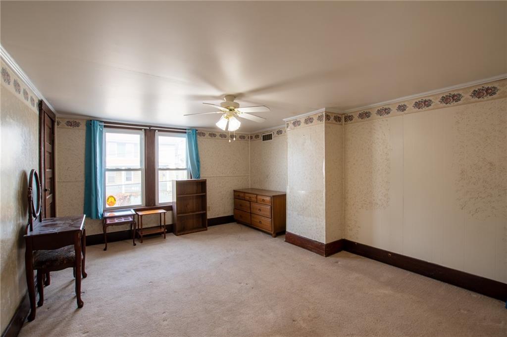 431 East Washington Street Rochester, PA 15074 - Photo 23 of 32 a living room with furniture and a chandelier