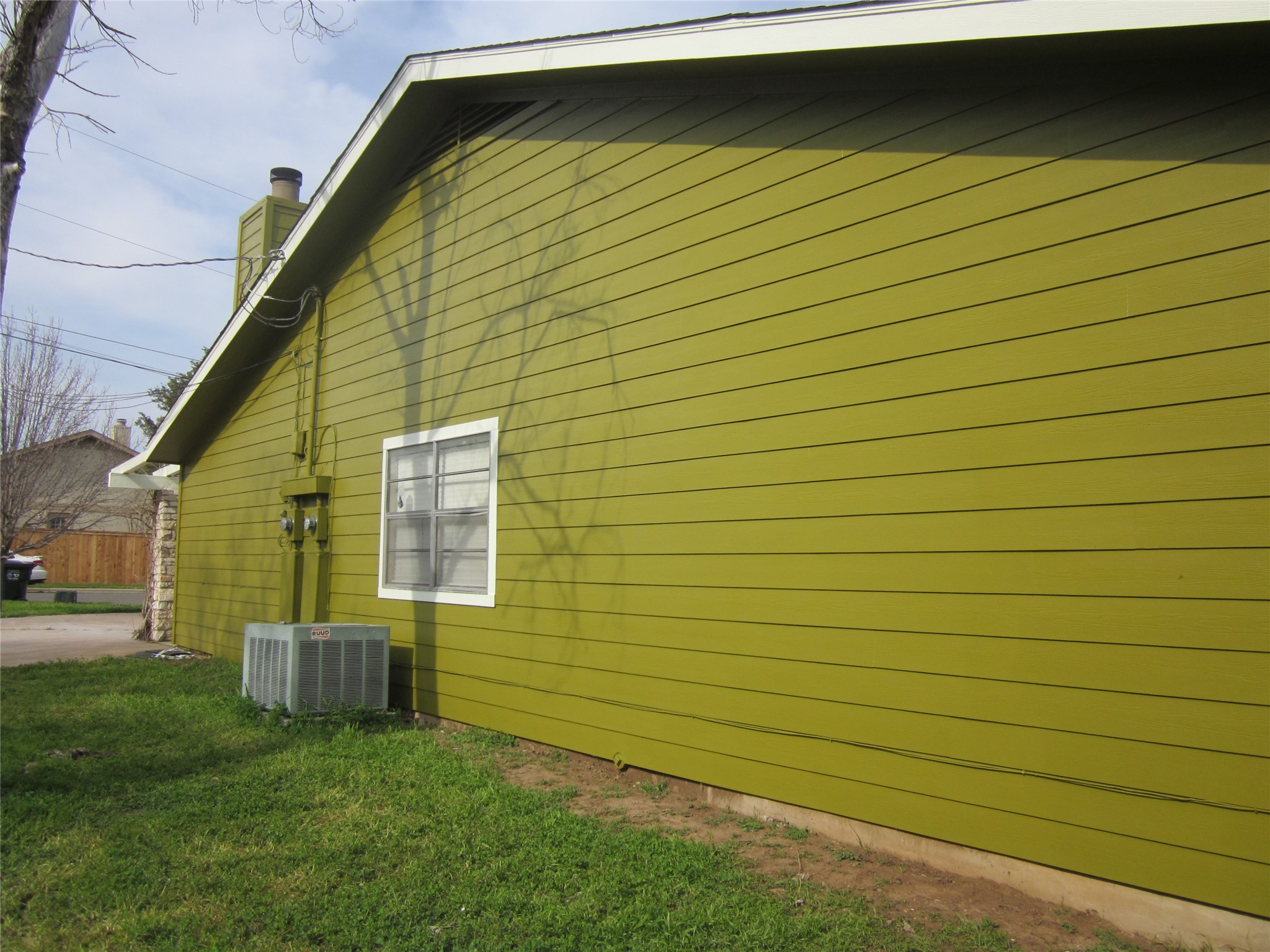 102 Verna Spur, Unit B Georgetown, TX 78628 - Photo 4 of 18 View of side of home with a yard and a chimney