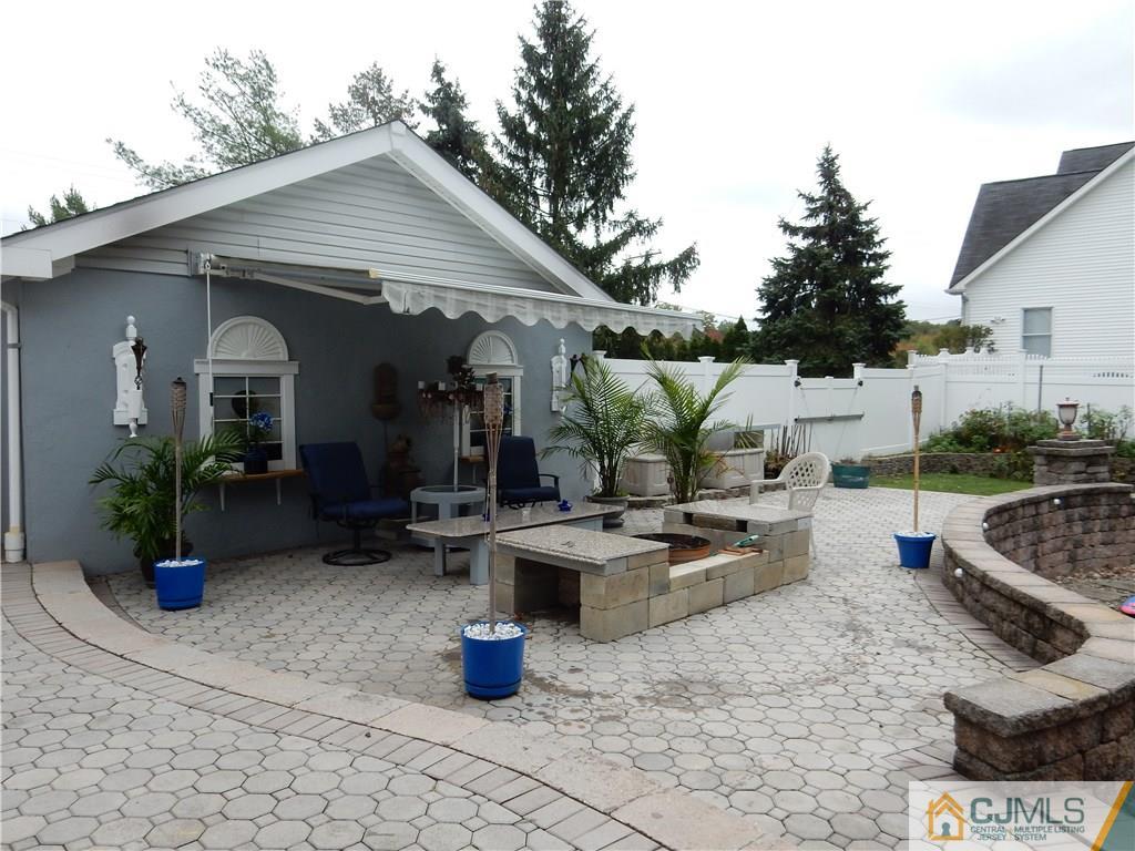 281 Amboy Road Old Bridge, NJ 07747 - Photo 22 of 25 a view of a patio with couches chairs and potted plants