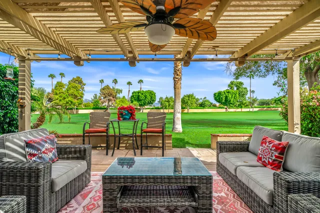 a outdoor living space with furniture and garden view