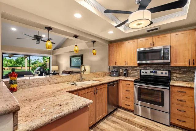 a view of a chairs and a table in a kitchen