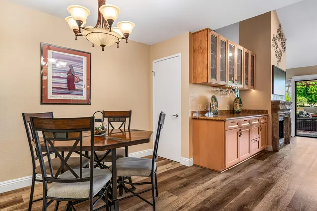 a bedroom with bed and a chandelier