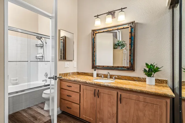 a bathroom with a bathtub and shower