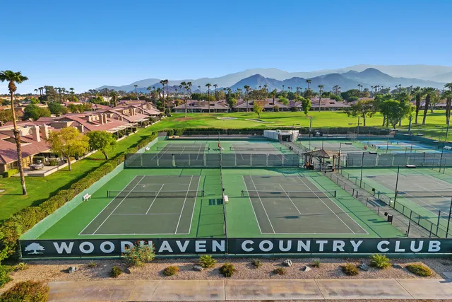 a view of a park with large trees