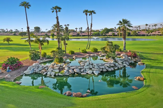 a view of a lake with a yard