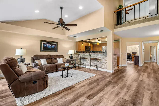 a living room with furniture and a fireplace
