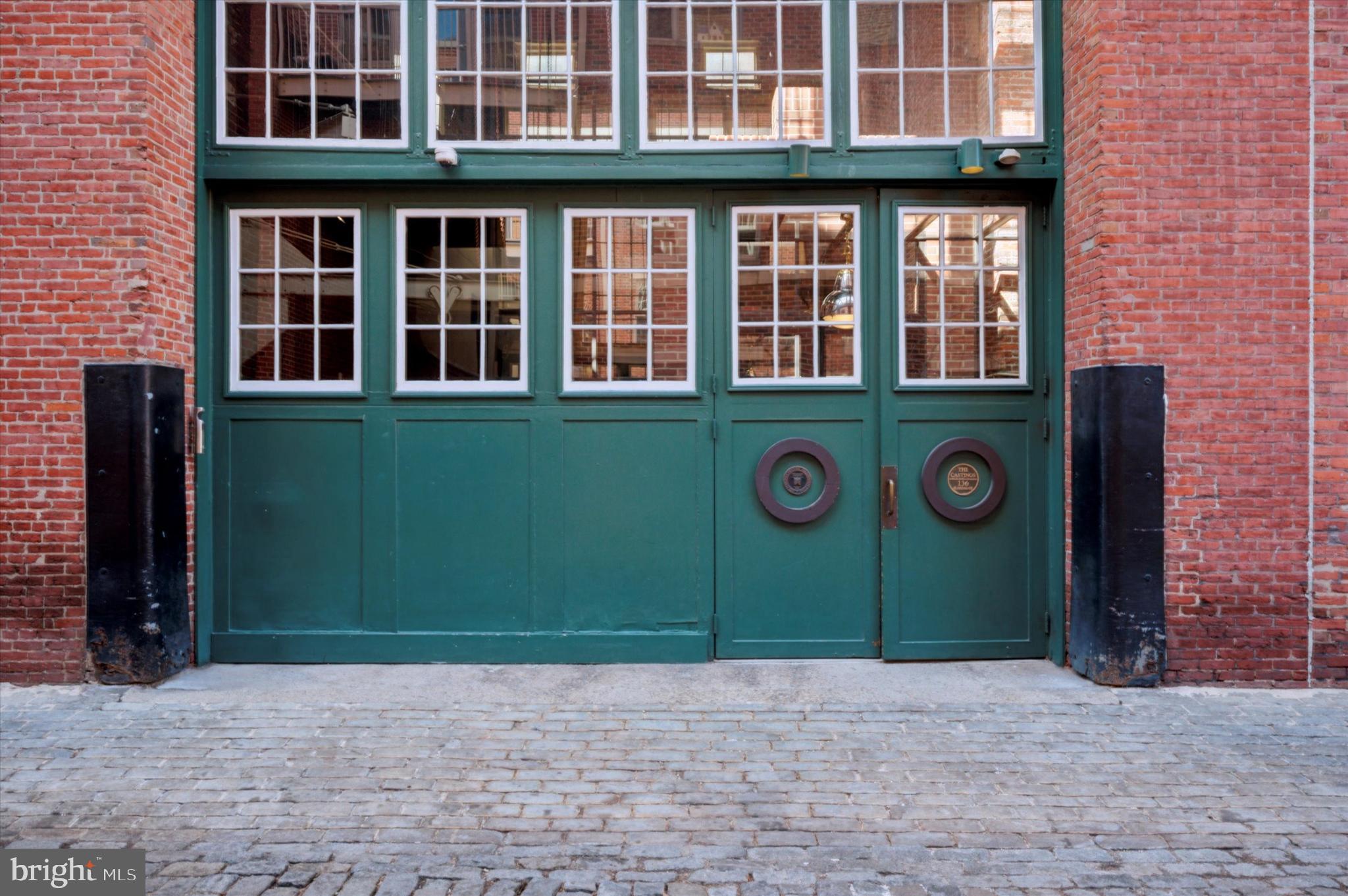 a view of an brick house with a entrance