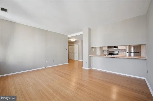 a view of kitchen with wooden floor