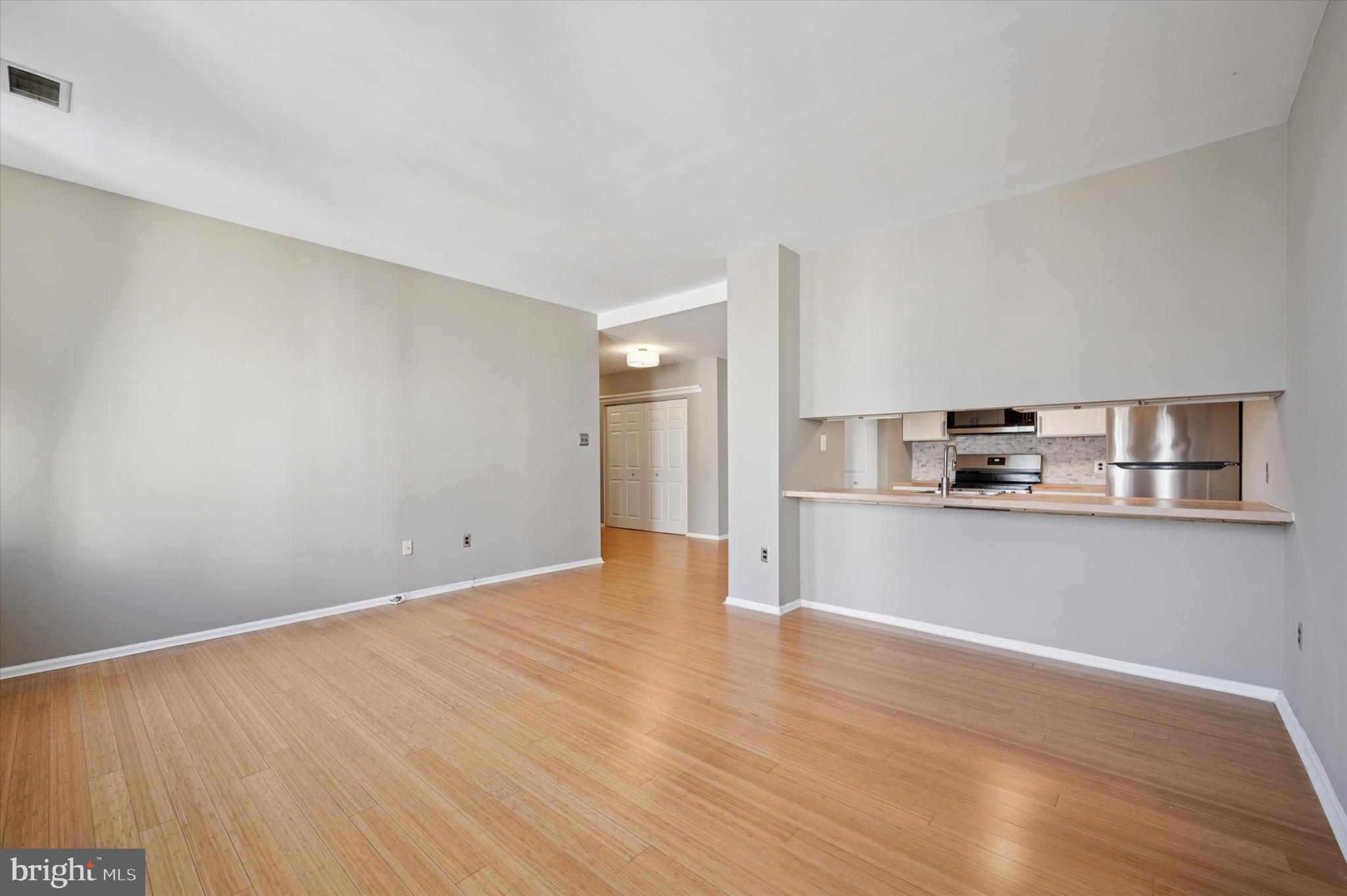 130 North Bread Street, Unit 310 Philadelphia, PA 19106 - Photo 11 of 16 a view of kitchen with wooden floor
