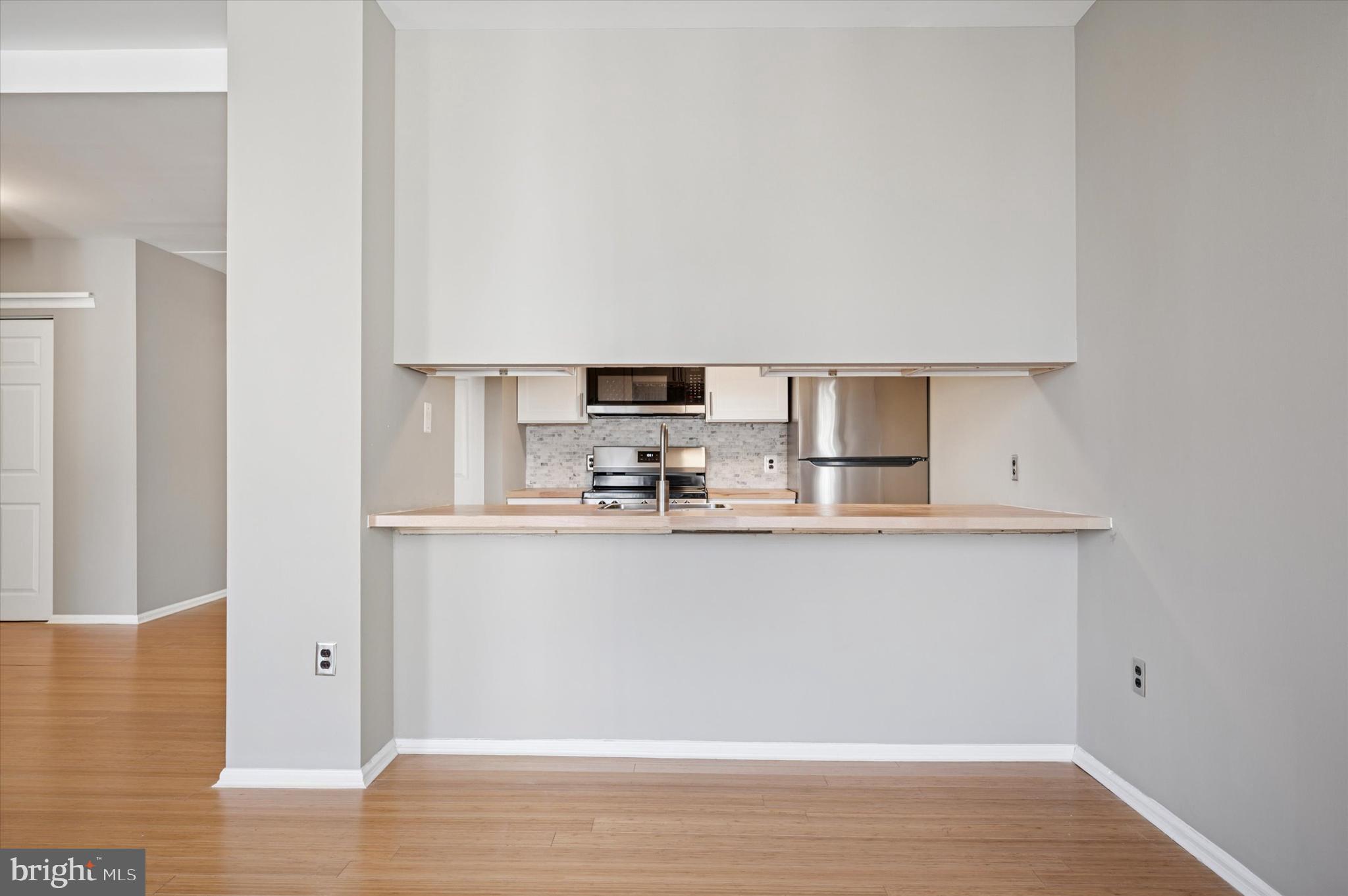 130 North Bread Street, Unit 310 Philadelphia, PA 19106 - Photo 12 of 16 a view of kitchen with stainless steel appliances granite countertop refrigerator sink and stove