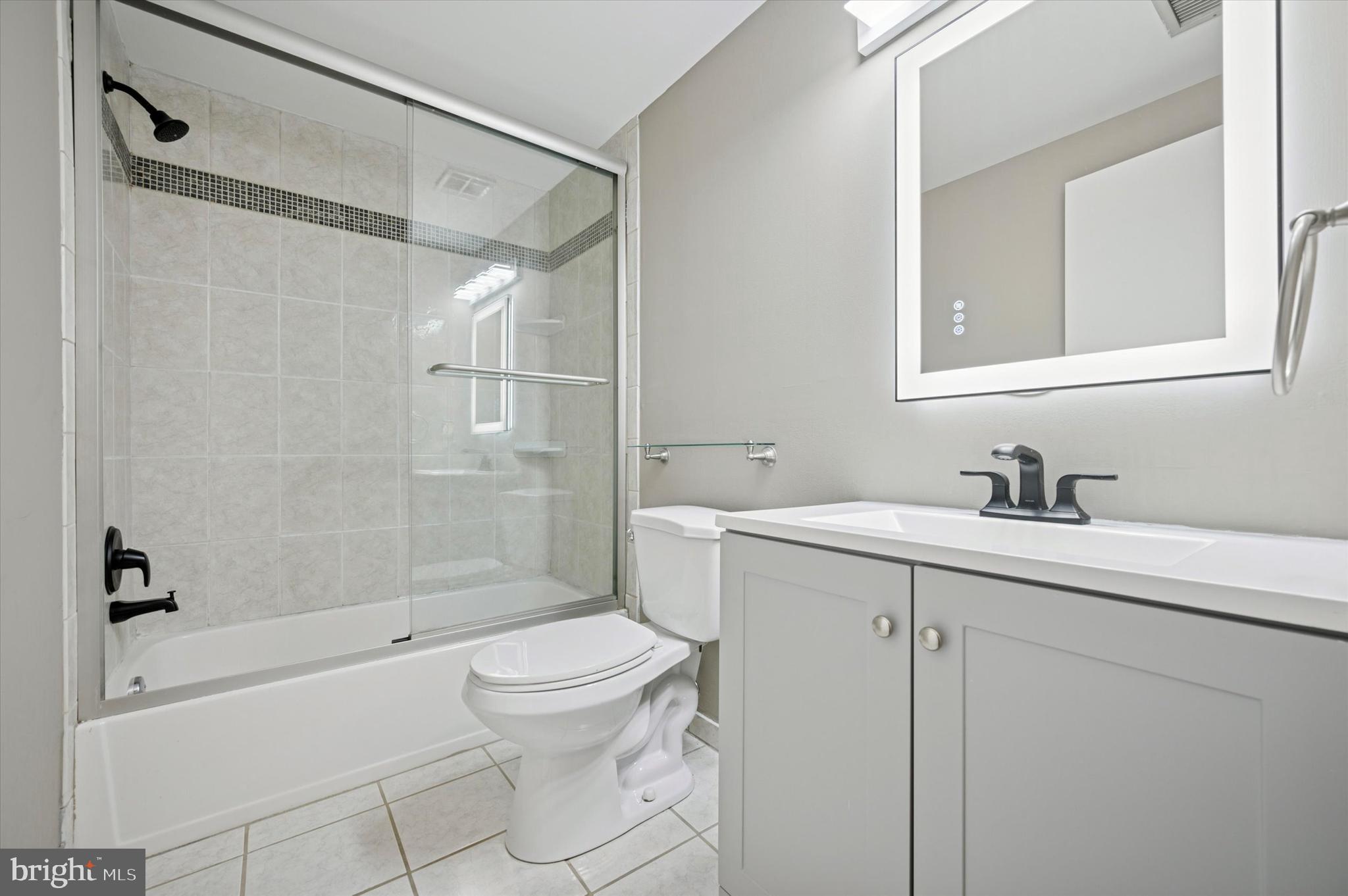 130 North Bread Street, Unit 310 Philadelphia, PA 19106 - Photo 14 of 16 a bathroom with a sink toilet and shower