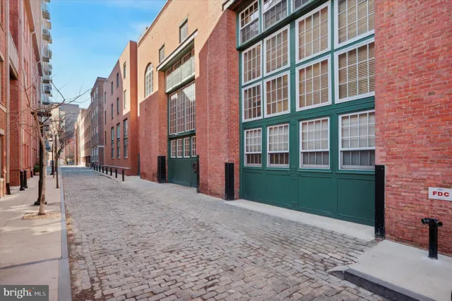 a view of a building with a yard