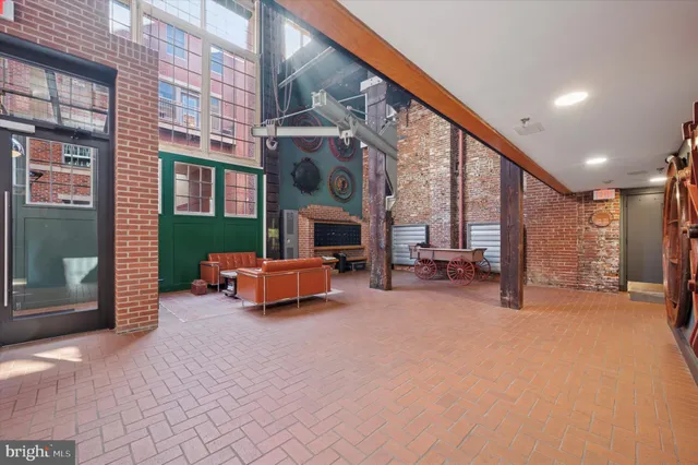 a view of a livingroom with furniture and a fireplace