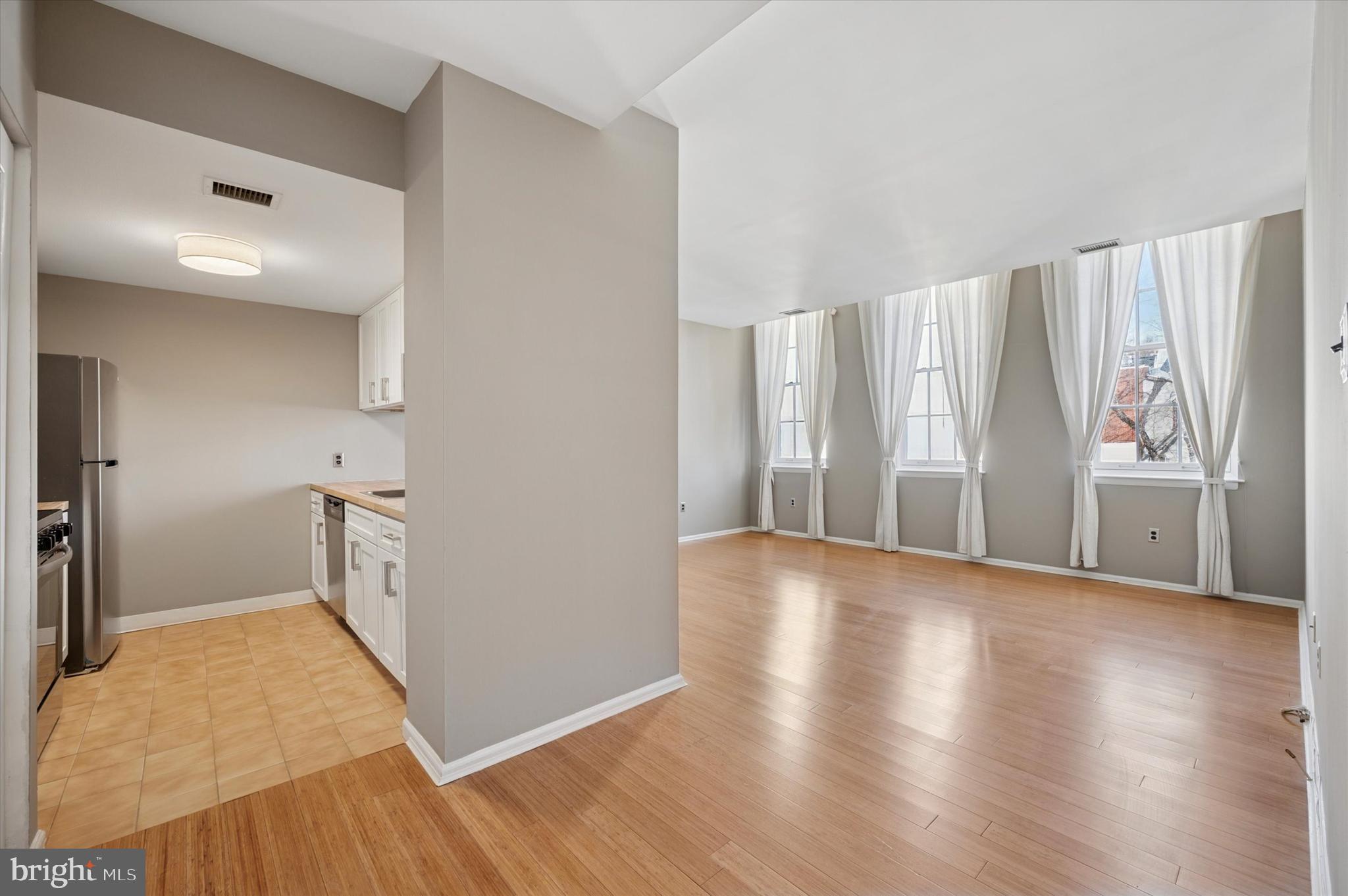 130 North Bread Street, Unit 310 Philadelphia, PA 19106 - Photo 6 of 16 a view of empty room with wooden floor