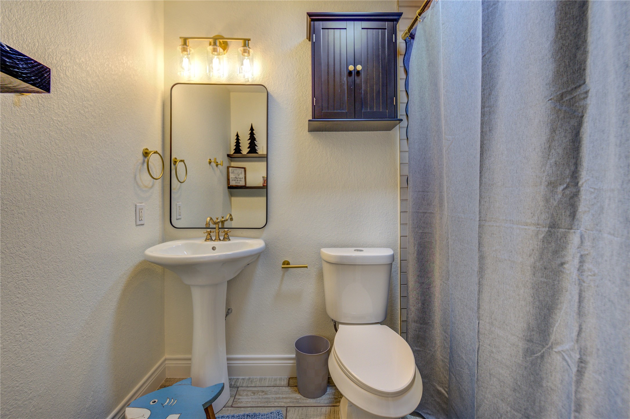 7706 Colston Place Santa Fe, TX 77510 - Photo 12 of 16 a white toilet sitting next to a bathroom sink