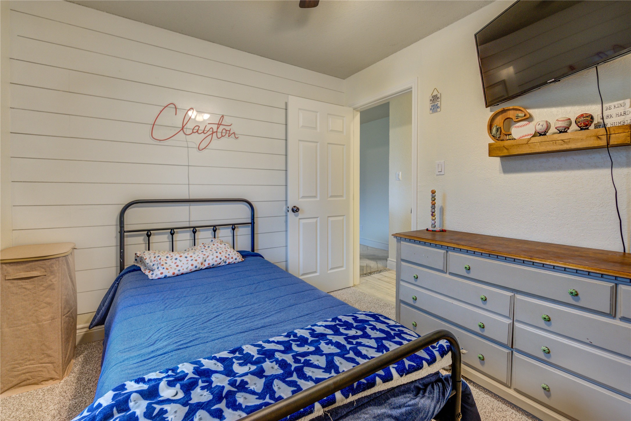 7706 Colston Place Santa Fe, TX 77510 - Photo 14 of 16 a bedroom with a bed and painting on the wall