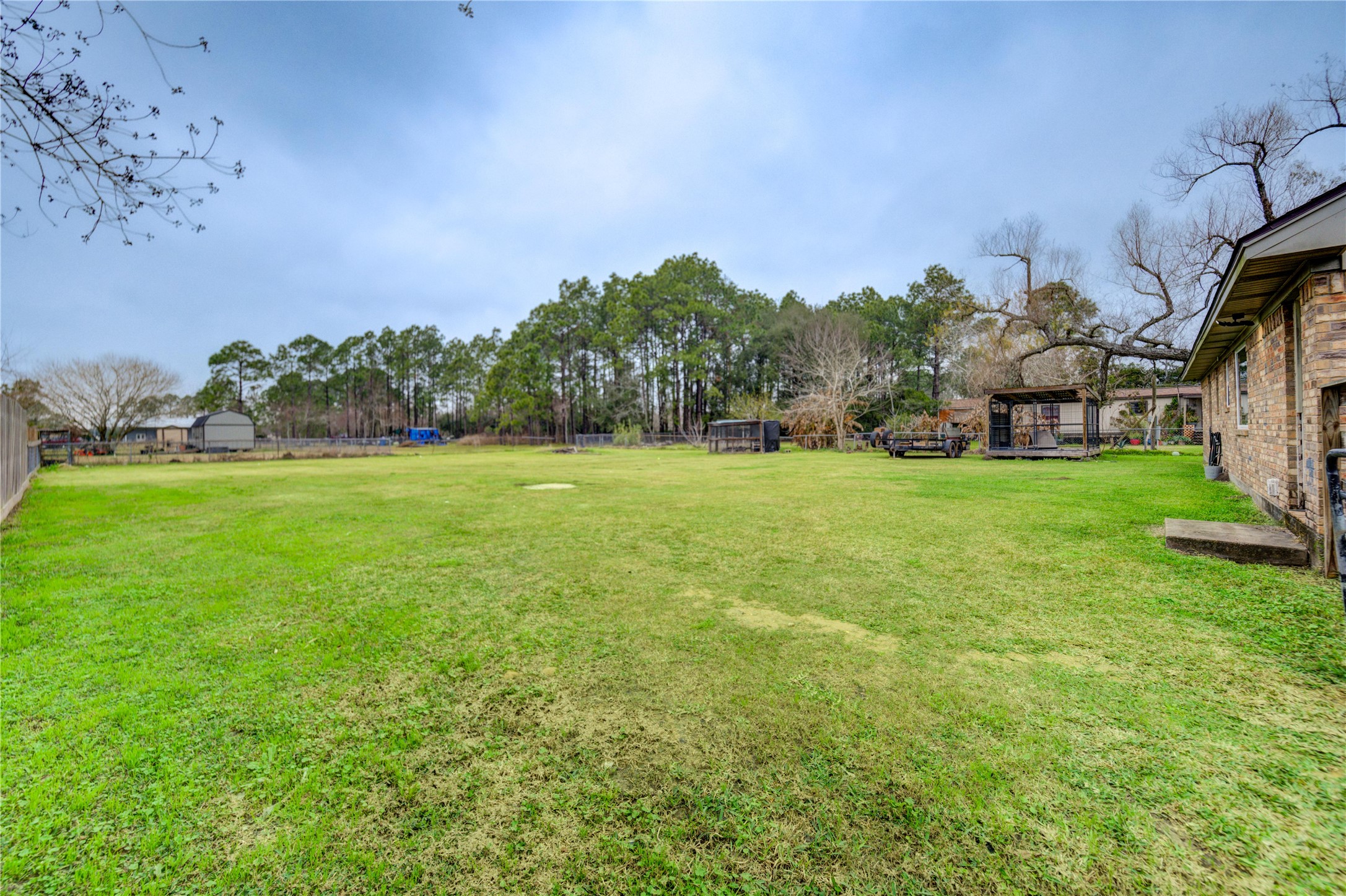 7706 Colston Place Santa Fe, TX 77510 - Photo 16 of 16 a backyard of a house with lots of green space