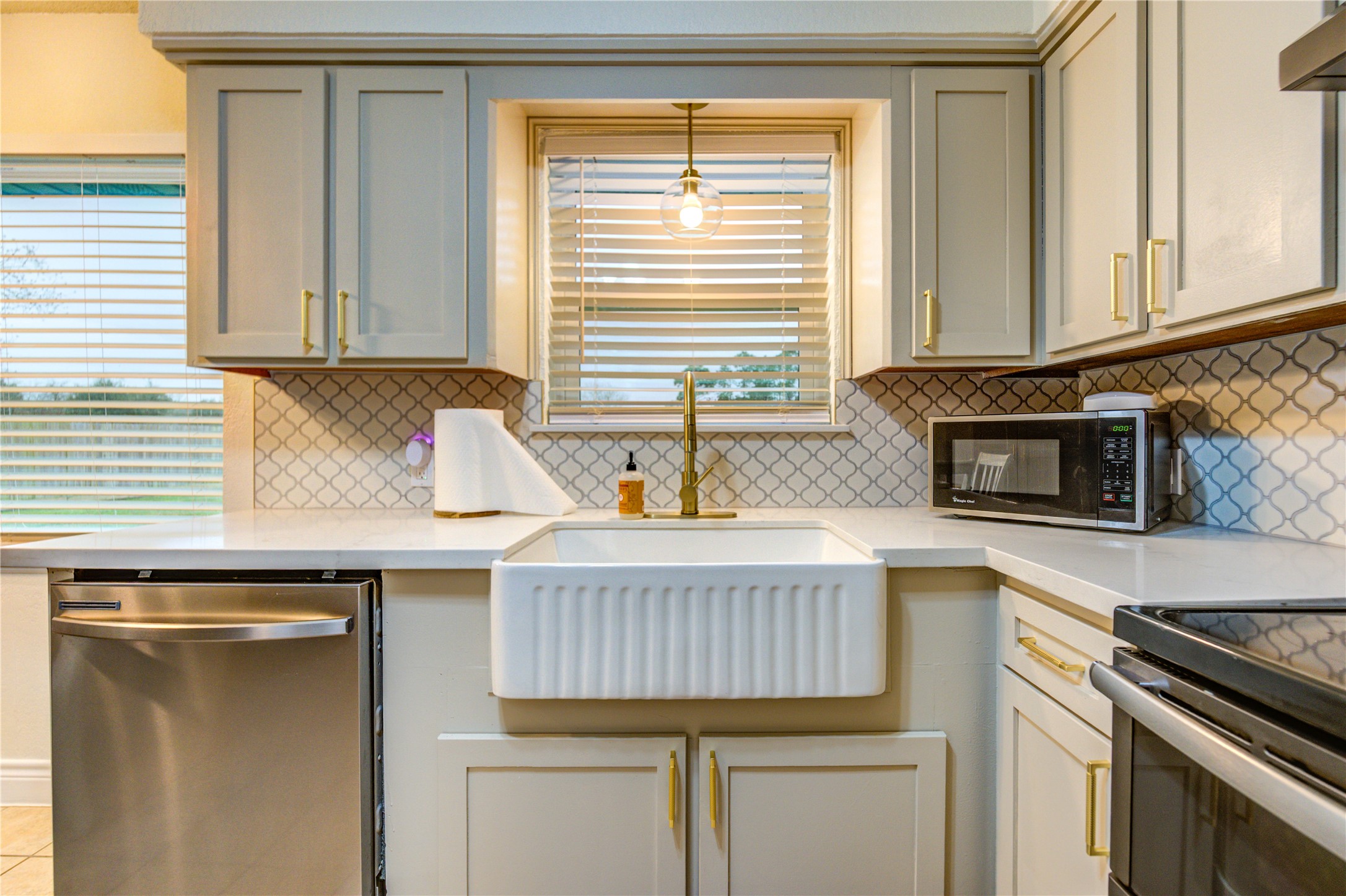 7706 Colston Place Santa Fe, TX 77510 - Photo 8 of 16 a kitchen with granite countertop a sink and a stove