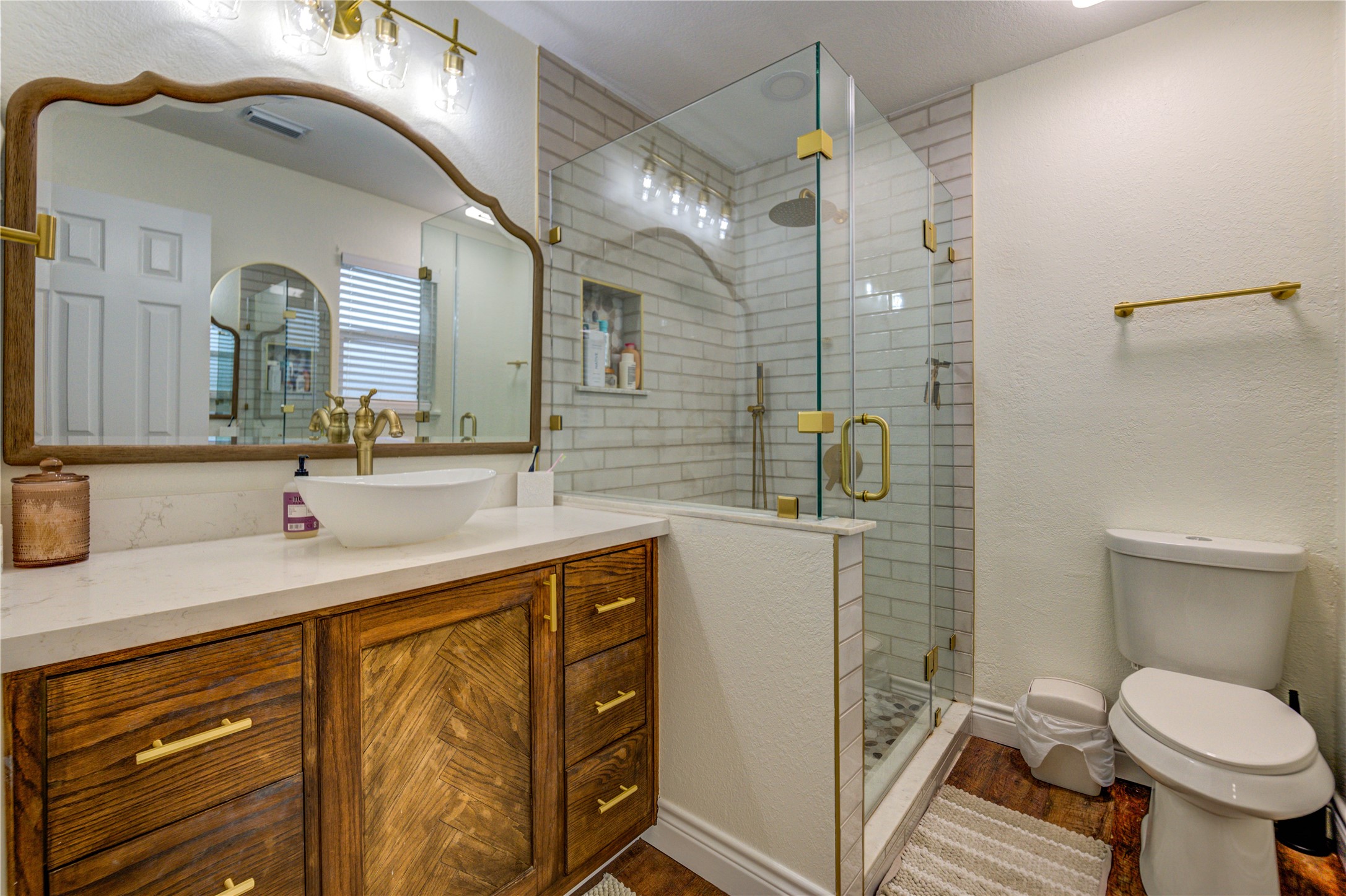 7706 Colston Place Santa Fe, TX 77510 - Photo 9 of 16 a bathroom with a sink a toilet and mirror