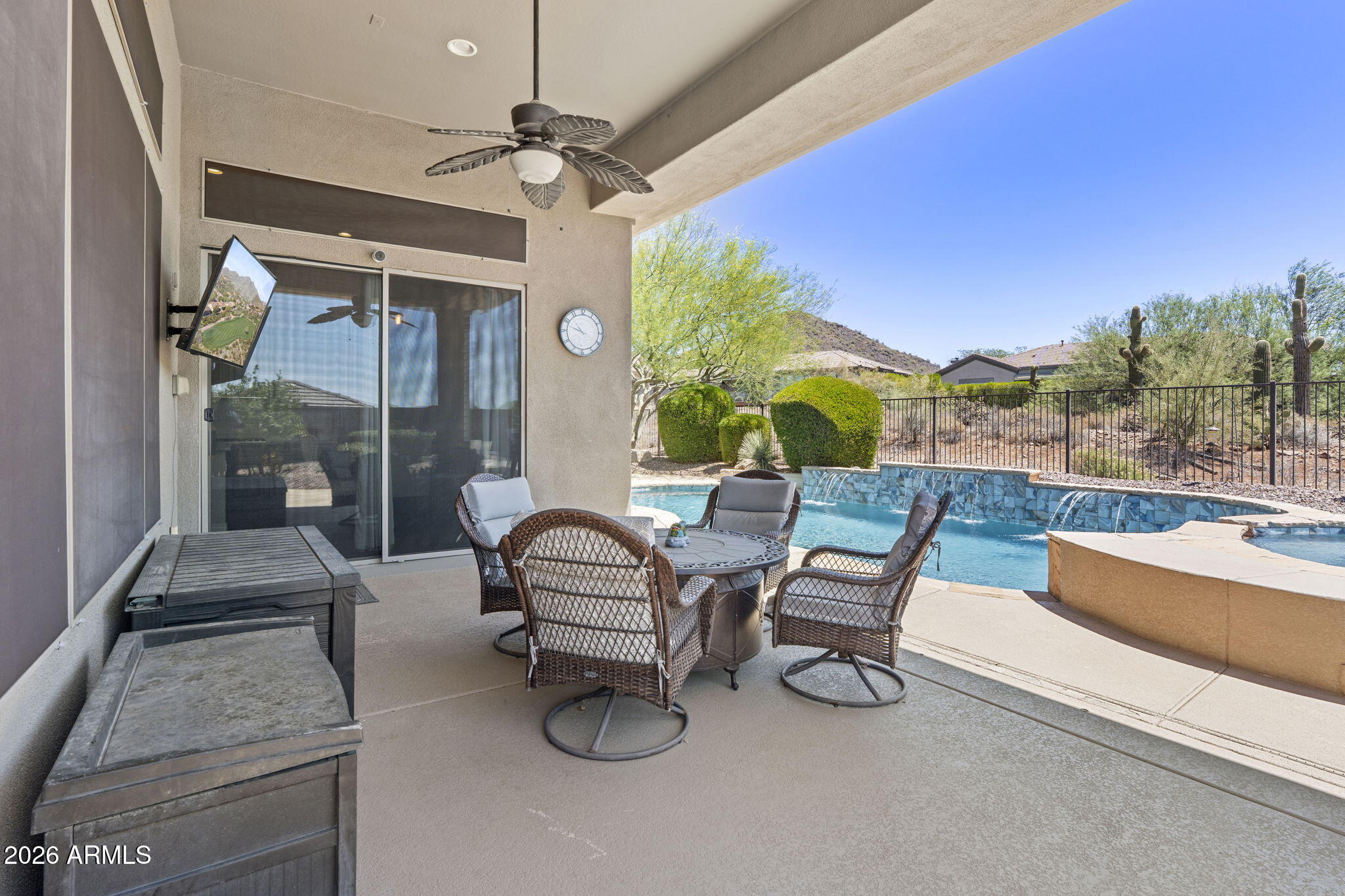41619 North River Bend Road Anthem, AZ 85086 - Photo 18 of 84 a view of a patio with a table chairs and a swimming pool