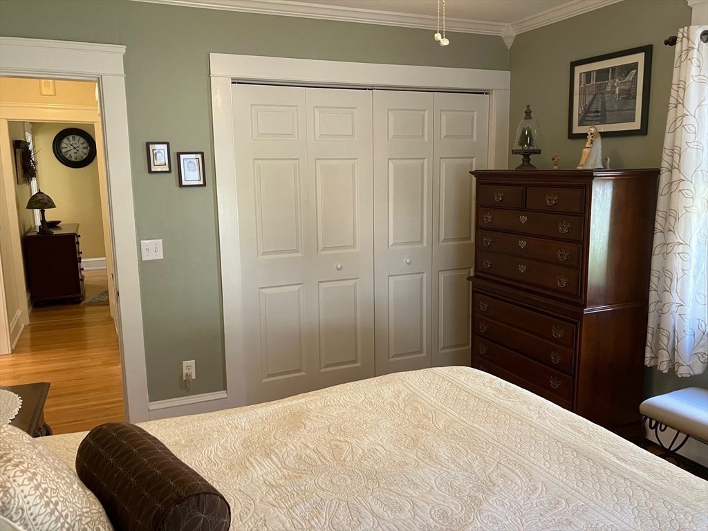 93 Crown Avenue Riverside, RI 02915 - Photo 13 of 33 a bedroom with a bed and a dresser