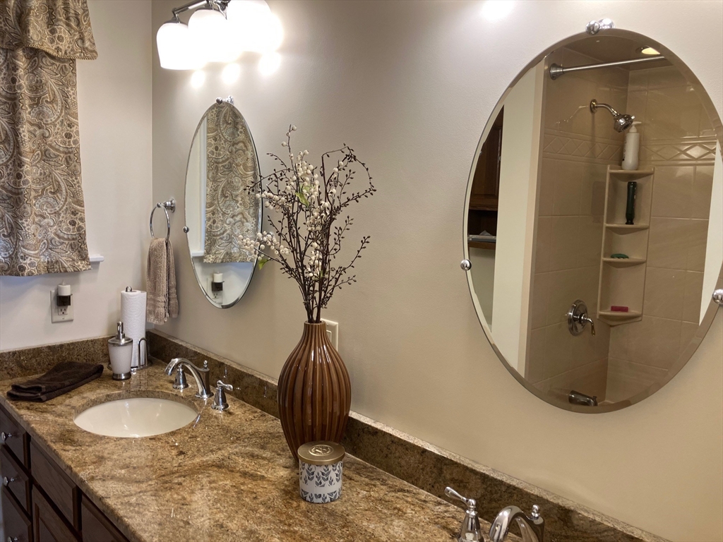 93 Crown Avenue Riverside, RI 02915 - Photo 15 of 33 a bathroom with a double vanity sink and a mirror