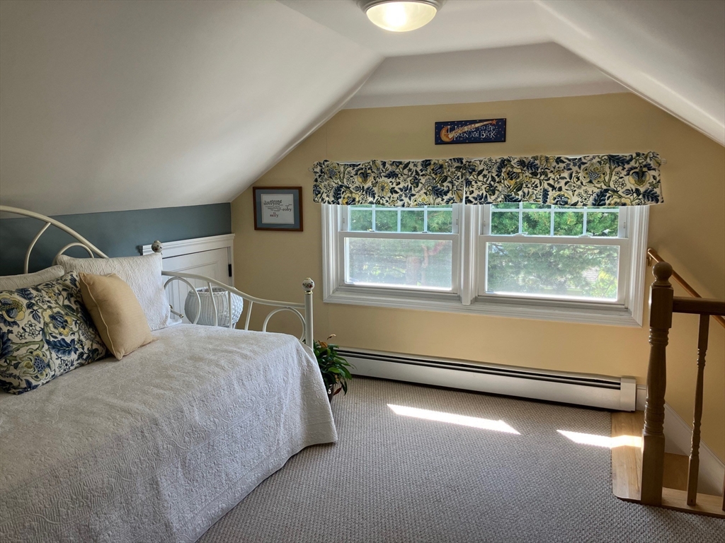 93 Crown Avenue Riverside, RI 02915 - Photo 20 of 33 a bedroom with a bed and a window