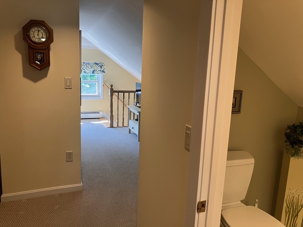 93 Crown Avenue Riverside, RI 02915 - Photo 21 of 33 a view of a hallway with toilet