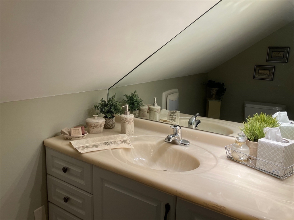 93 Crown Avenue Riverside, RI 02915 - Photo 25 of 33 a bathroom with a sink and a mirror