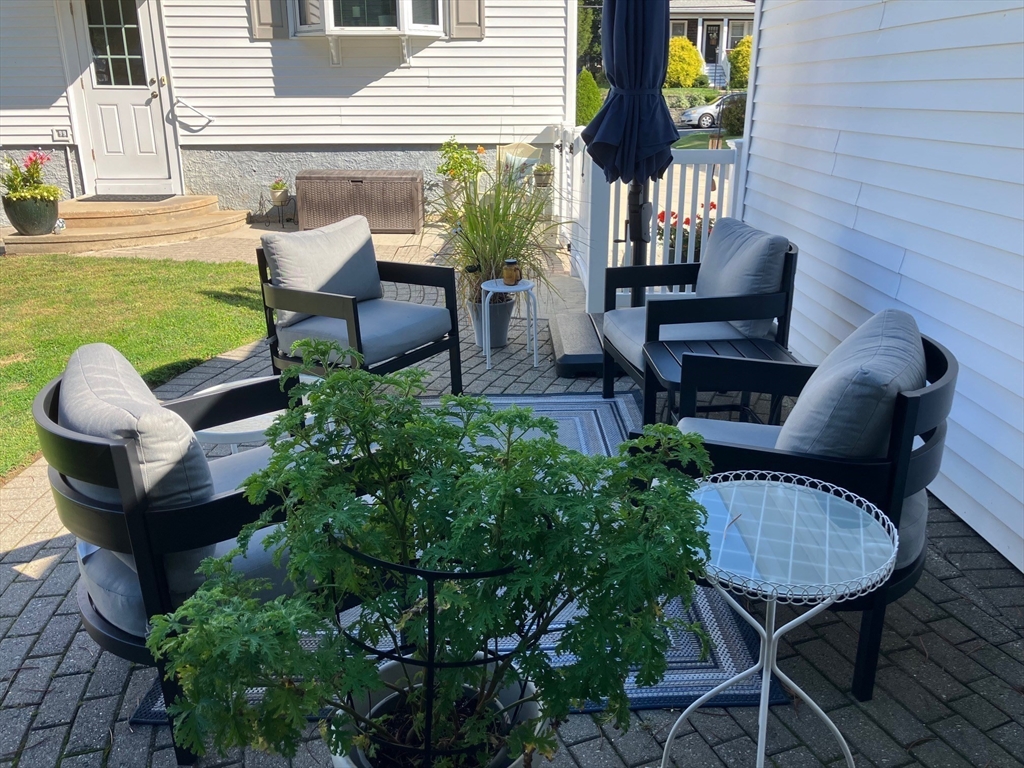 93 Crown Avenue Riverside, RI 02915 - Photo 31 of 33 a view of a chairs in backyard of the house