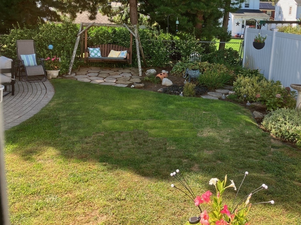 93 Crown Avenue Riverside, RI 02915 - Photo 32 of 33 a backyard of a house with lots of green space