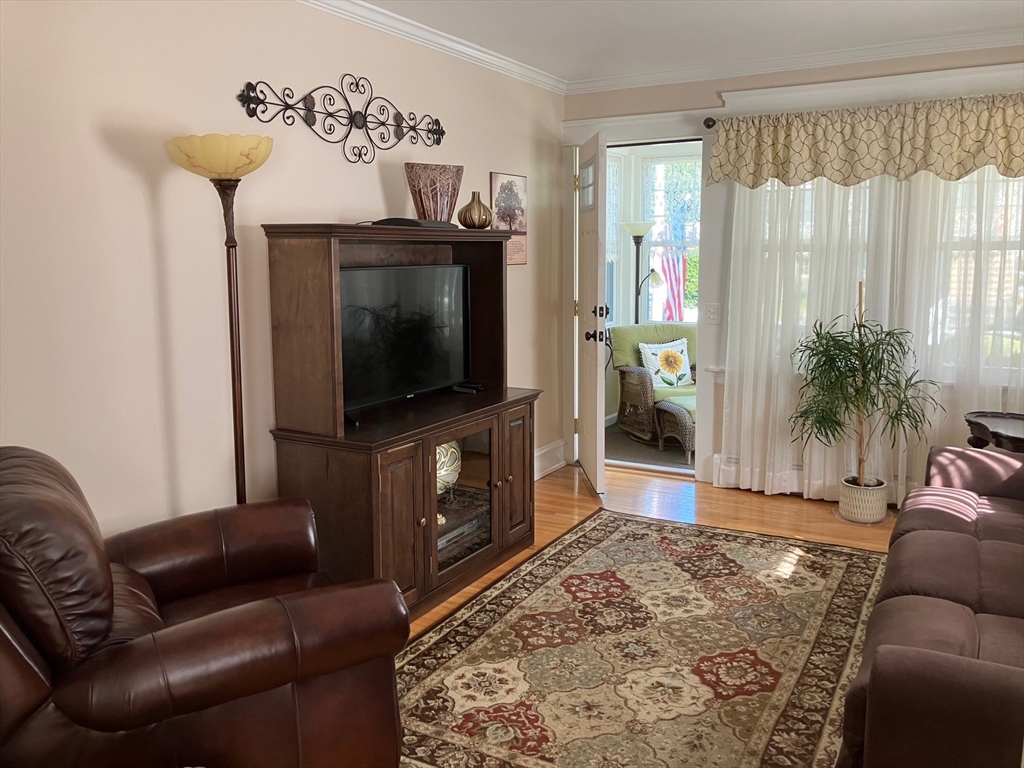 93 Crown Avenue Riverside, RI 02915 - Photo 5 of 33 a living room with furniture and a flat screen tv