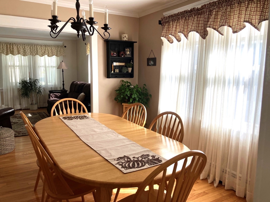 93 Crown Avenue Riverside, RI 02915 - Photo 7 of 33 a bedroom with a bed and a table