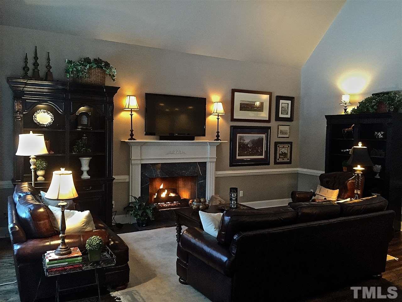 5805 Sand Pebble Place Raleigh, NC 27613 - Photo 2 of 17 a living room with furniture and a fireplace
