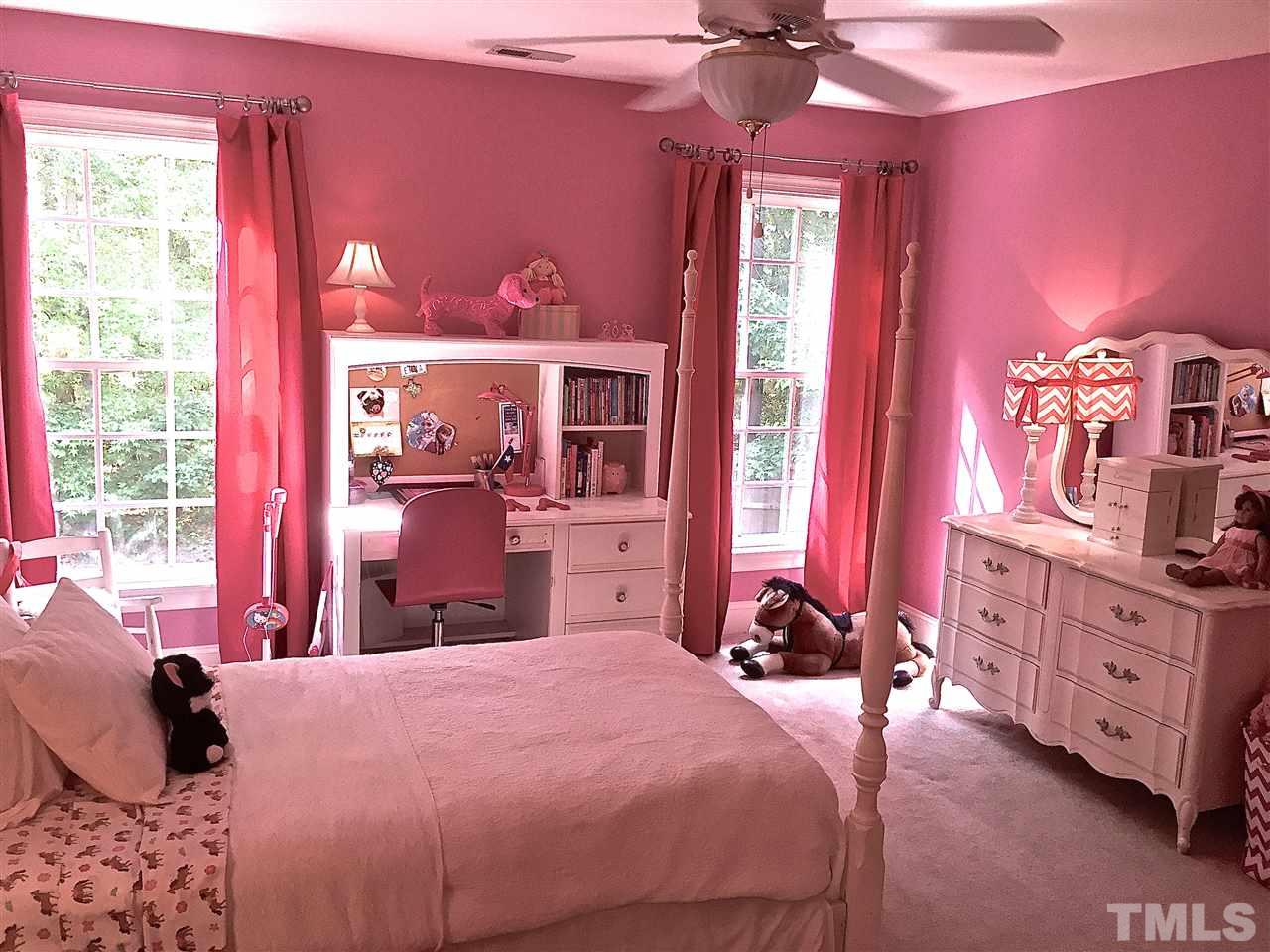 5805 Sand Pebble Place Raleigh, NC 27613 - Photo 11 of 17 a bedroom with a bed dresser and a window