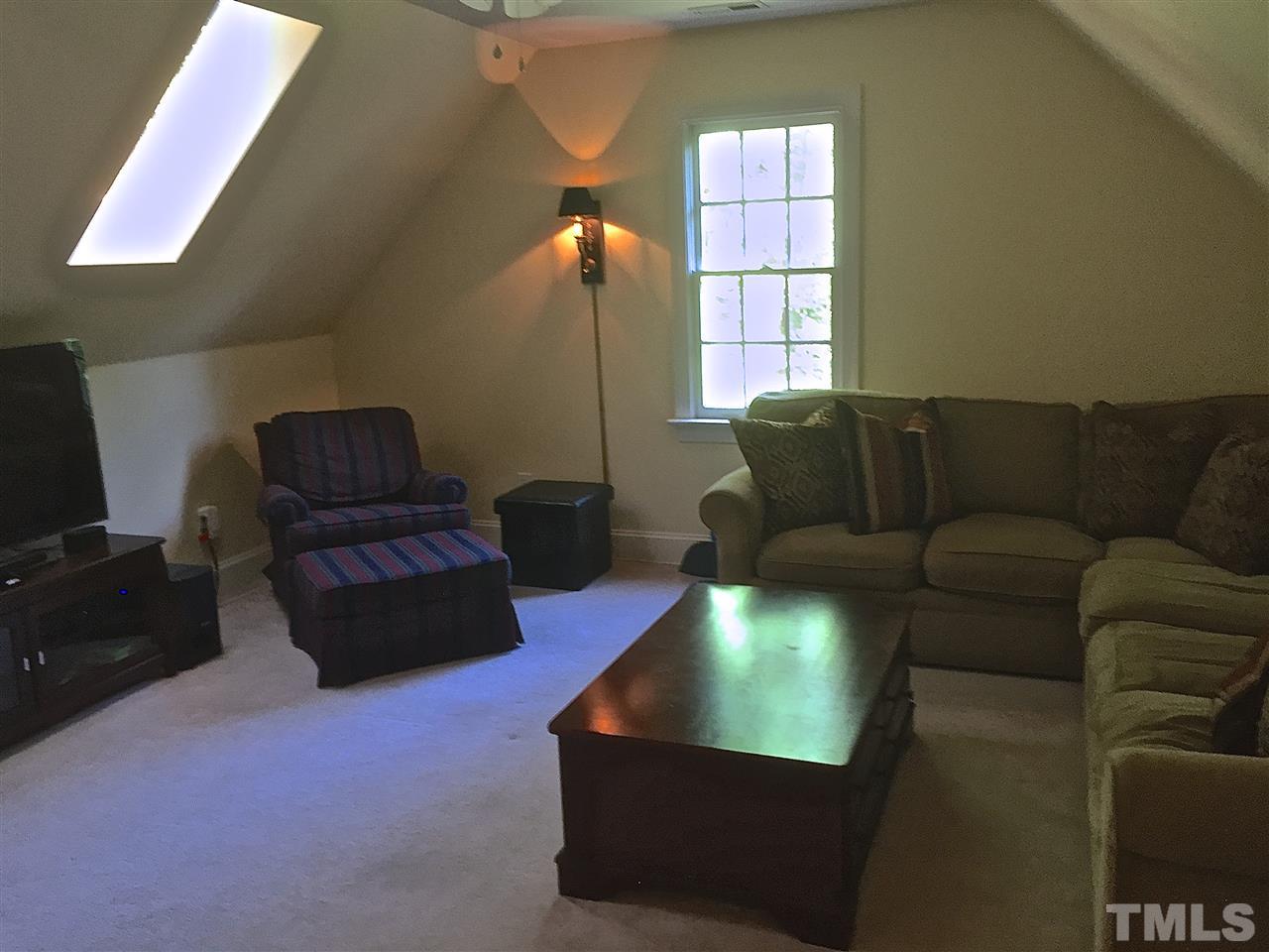 5805 Sand Pebble Place Raleigh, NC 27613 - Photo 14 of 17 a living room with furniture and a window
