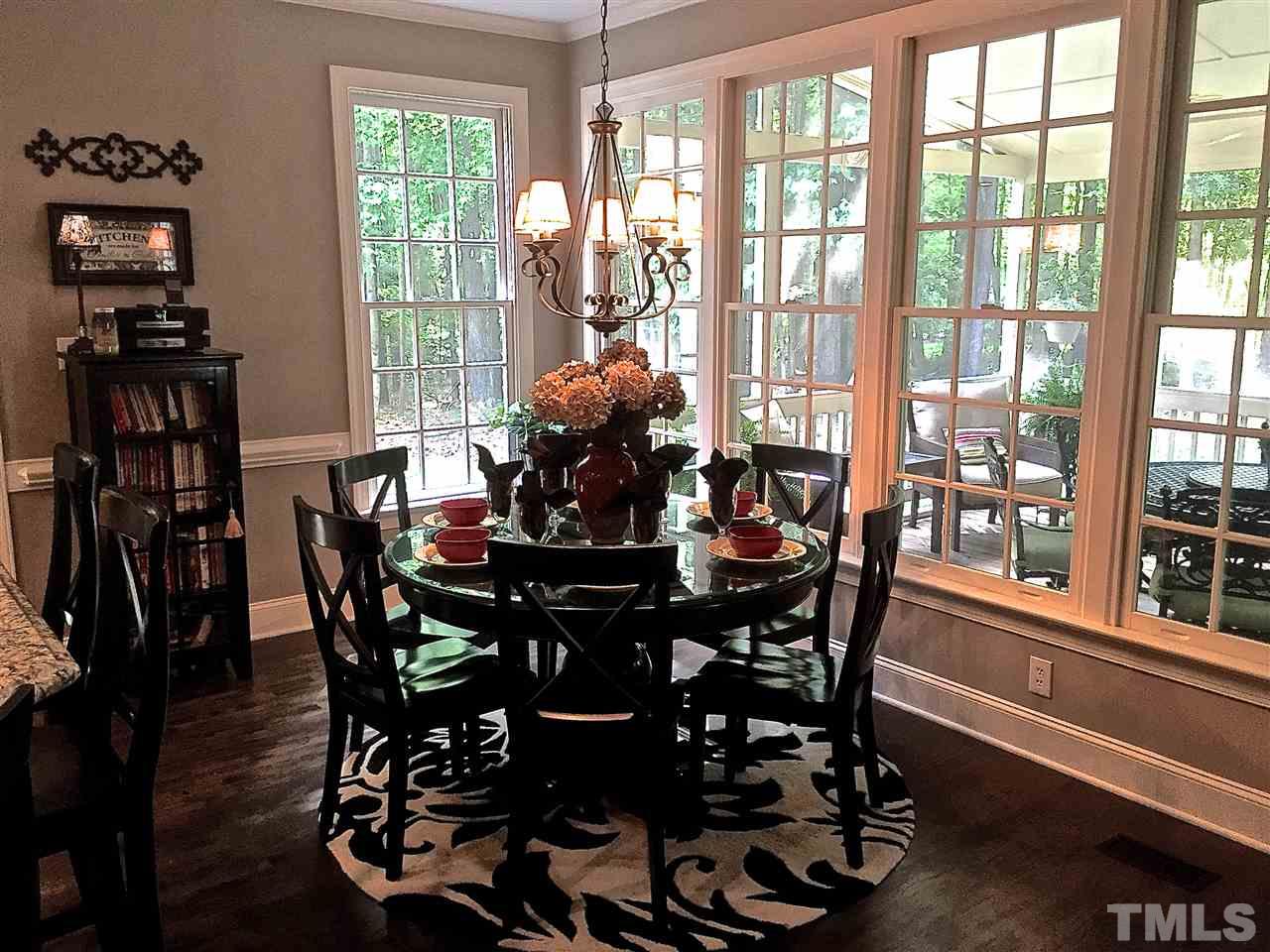 5805 Sand Pebble Place Raleigh, NC 27613 - Photo 7 of 17 a view of a dining room with furniture window and outside view