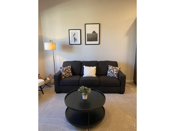 a living room with furniture and a couch