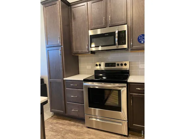 a kitchen with a stove and a microwave