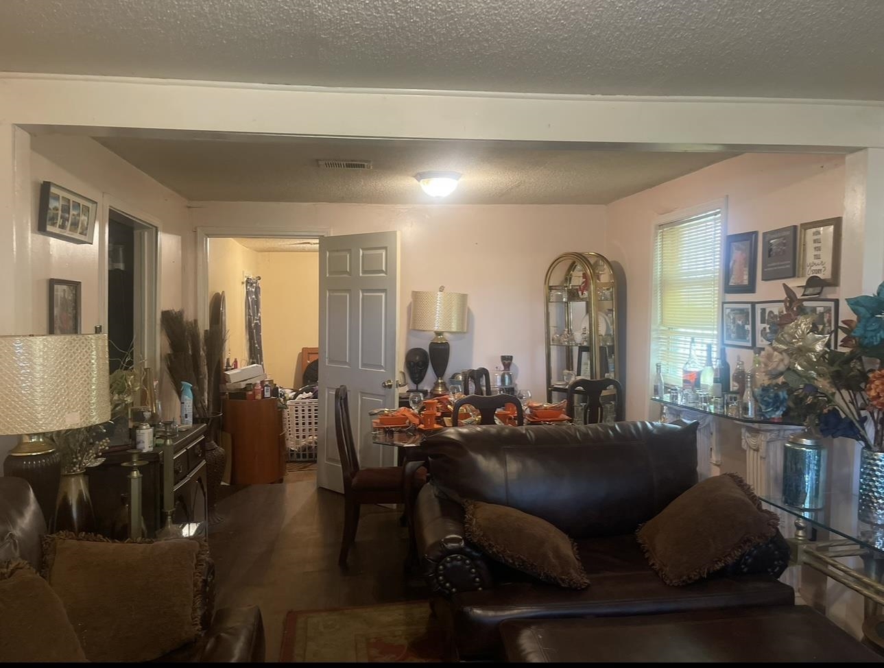 1679 Ragan Street Memphis, TN 38106 - Photo 3 of 9 a living room with furniture and wooden floor