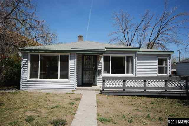 1024 Bell Street Reno, NV 89503 - Photo 1 of 13 a front view of a house with large windows