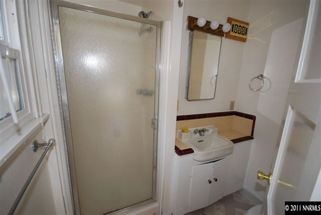 1024 Bell Street Reno, NV 89503 - Photo 5 of 13 a bathroom with a shower and a mirror