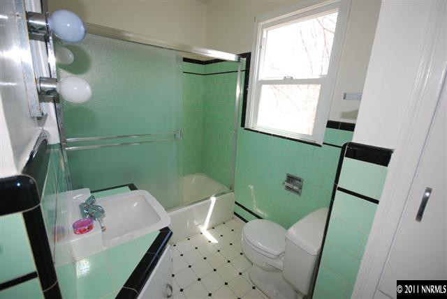 1024 Bell Street Reno, NV 89503 - Photo 10 of 13 a bathroom with a sink a toilet and a mirror