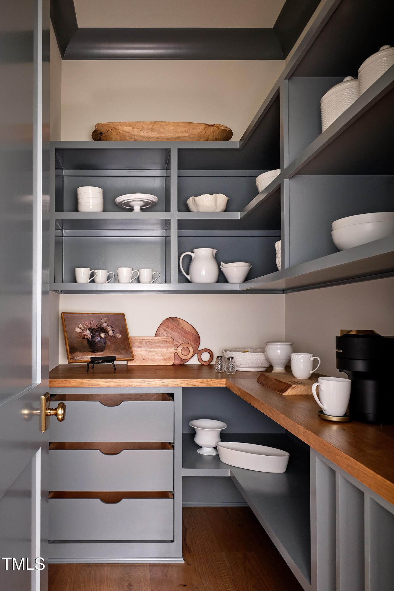 1307 Mayfair Road Raleigh, NC 27608 - Photo 31 of 59 a shelf with cup and plates